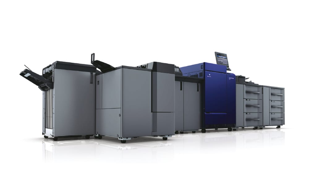 Konica Minolta C7090 colour production press, side profile showing the paper drawers